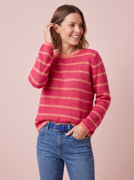 Loose fit women's jumper in cerise pink with narrow orange stripes and trim