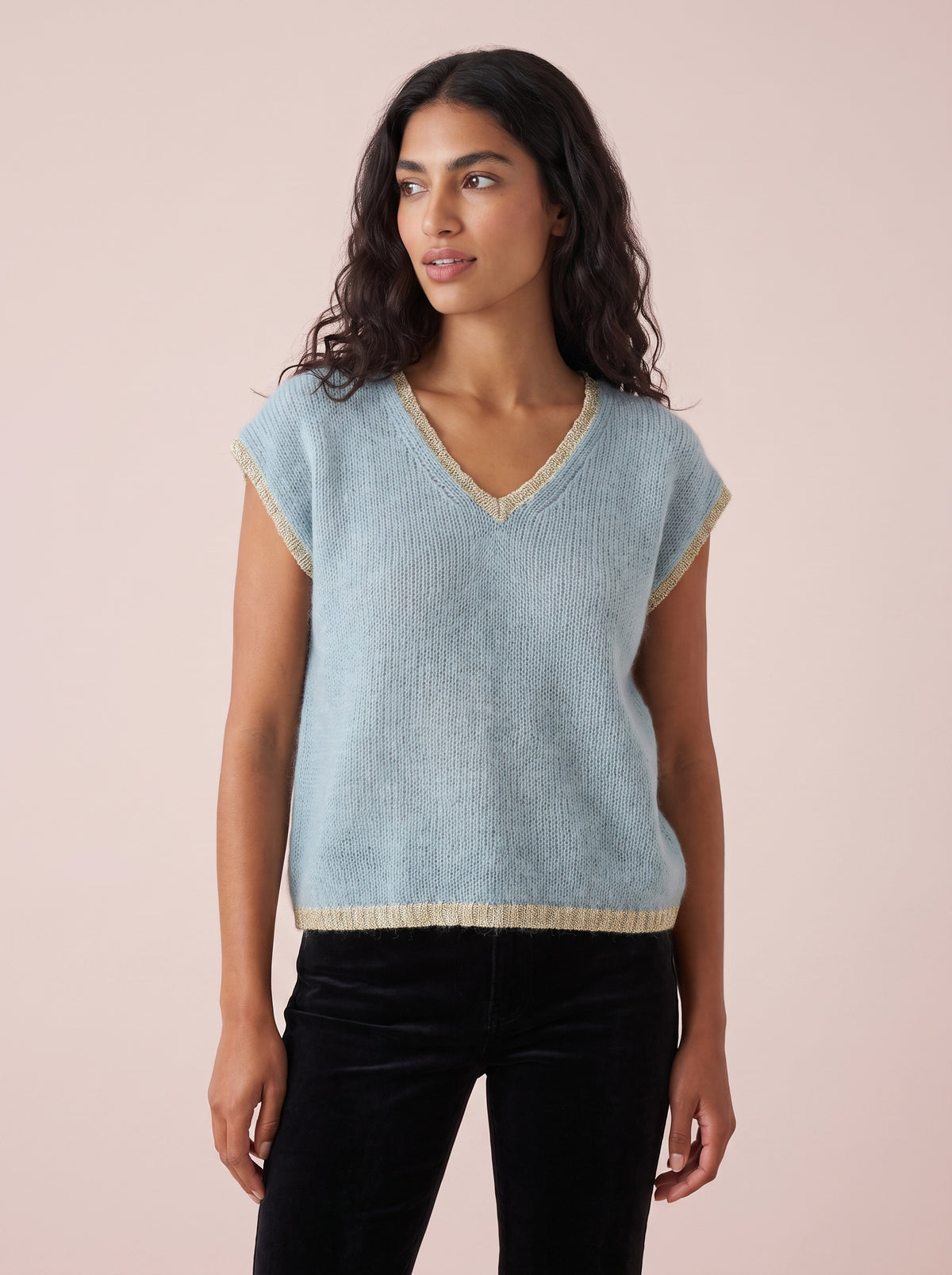 Pale dusky blue knitted tank top with a relaxed fit and shimmering silver gold lurex trim along the V neckline armholes and hem