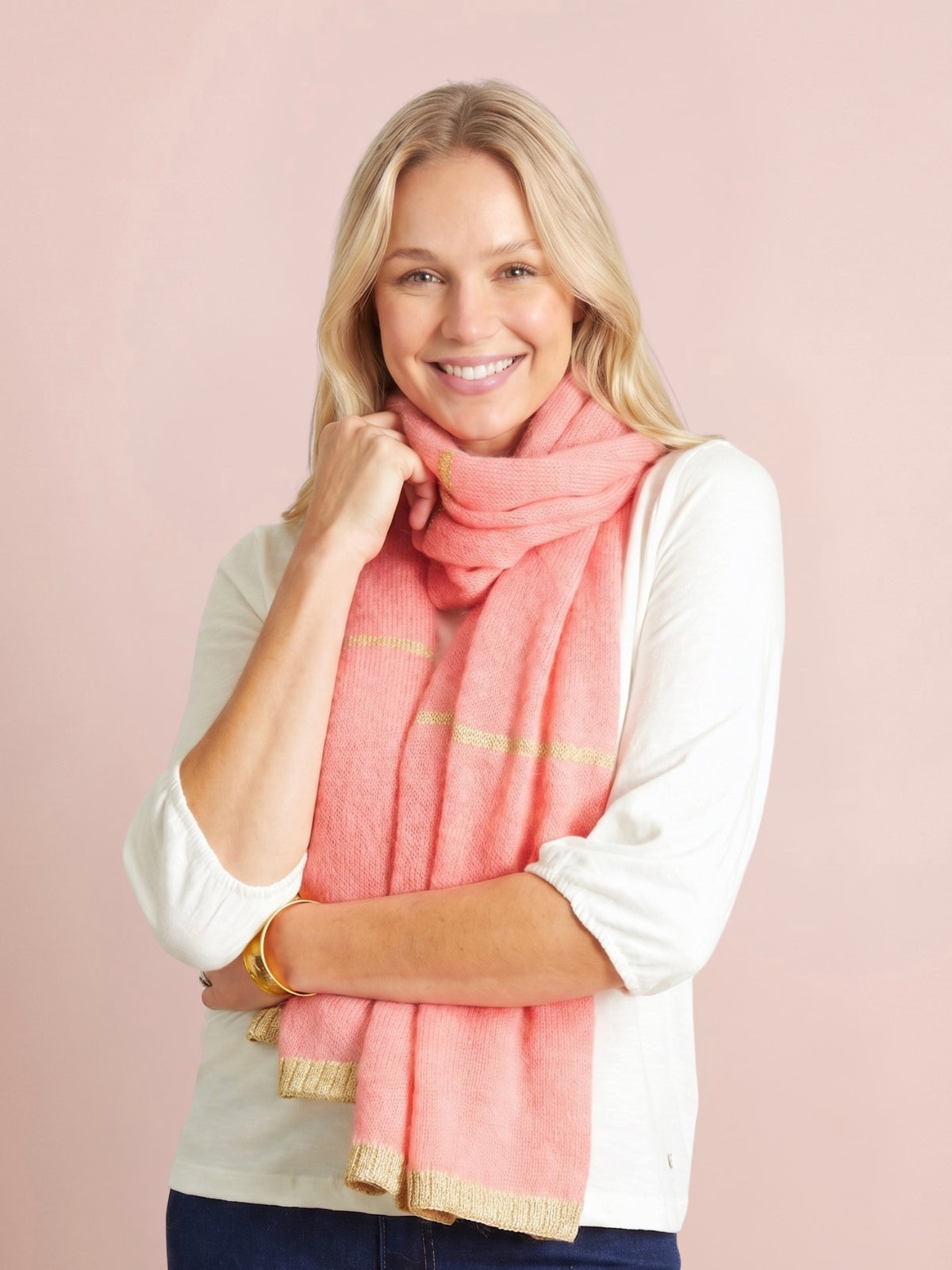 Rose pink knitted scarf with subtle gold lurex stripes and gold lurex trim at the ends