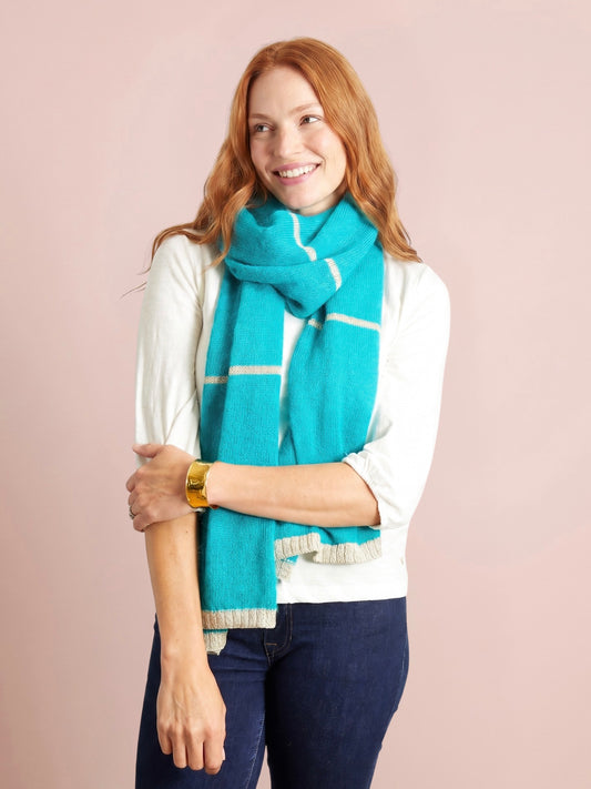 Turquoise teal knitted scarf with slim silver gold stripes and lurex trim finished with softly ribbed ends