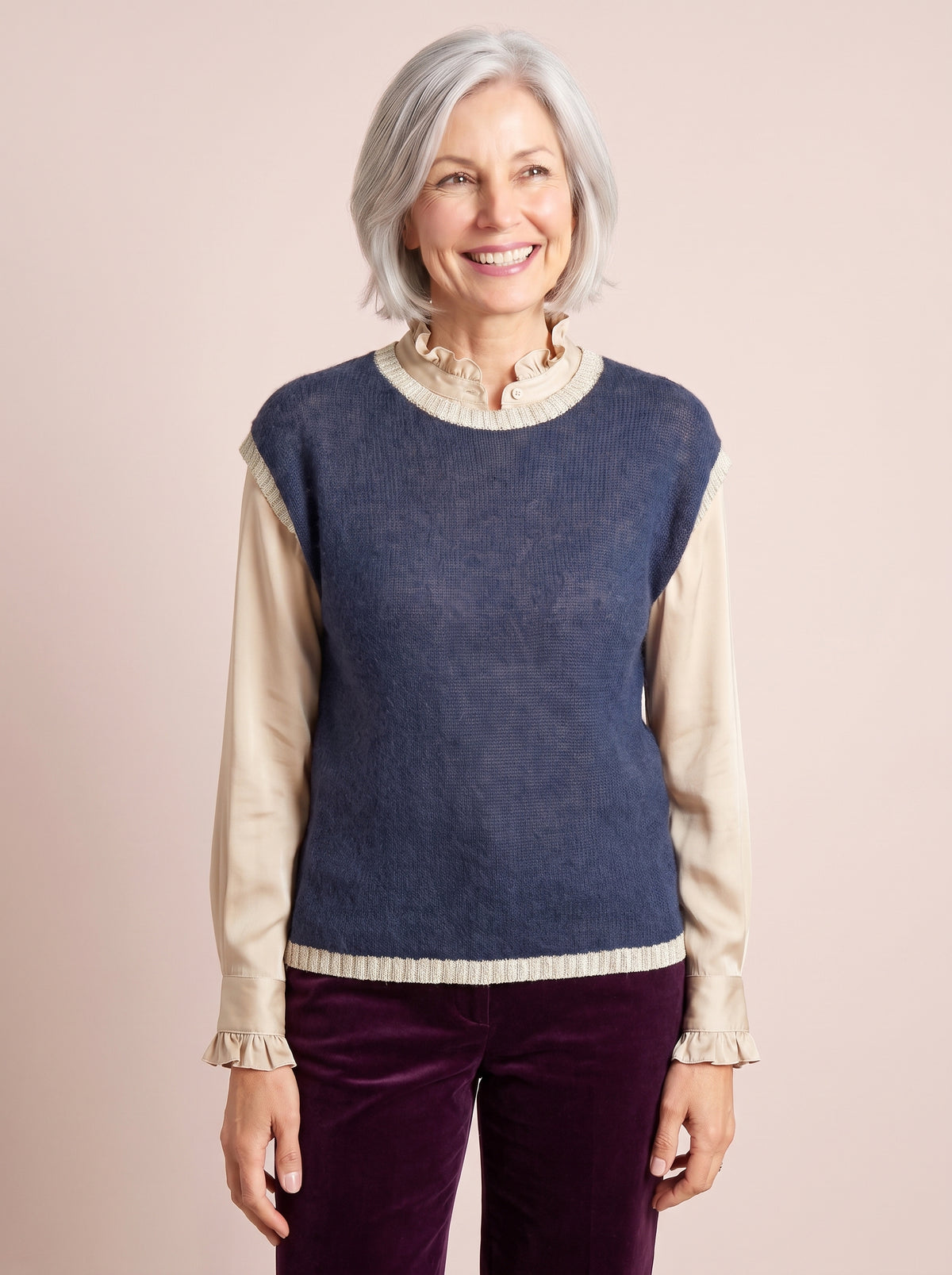 Navy blue sleeveless knitted tank top with a relaxed fit and contrasting champagne gold lurex crew neckline and hem