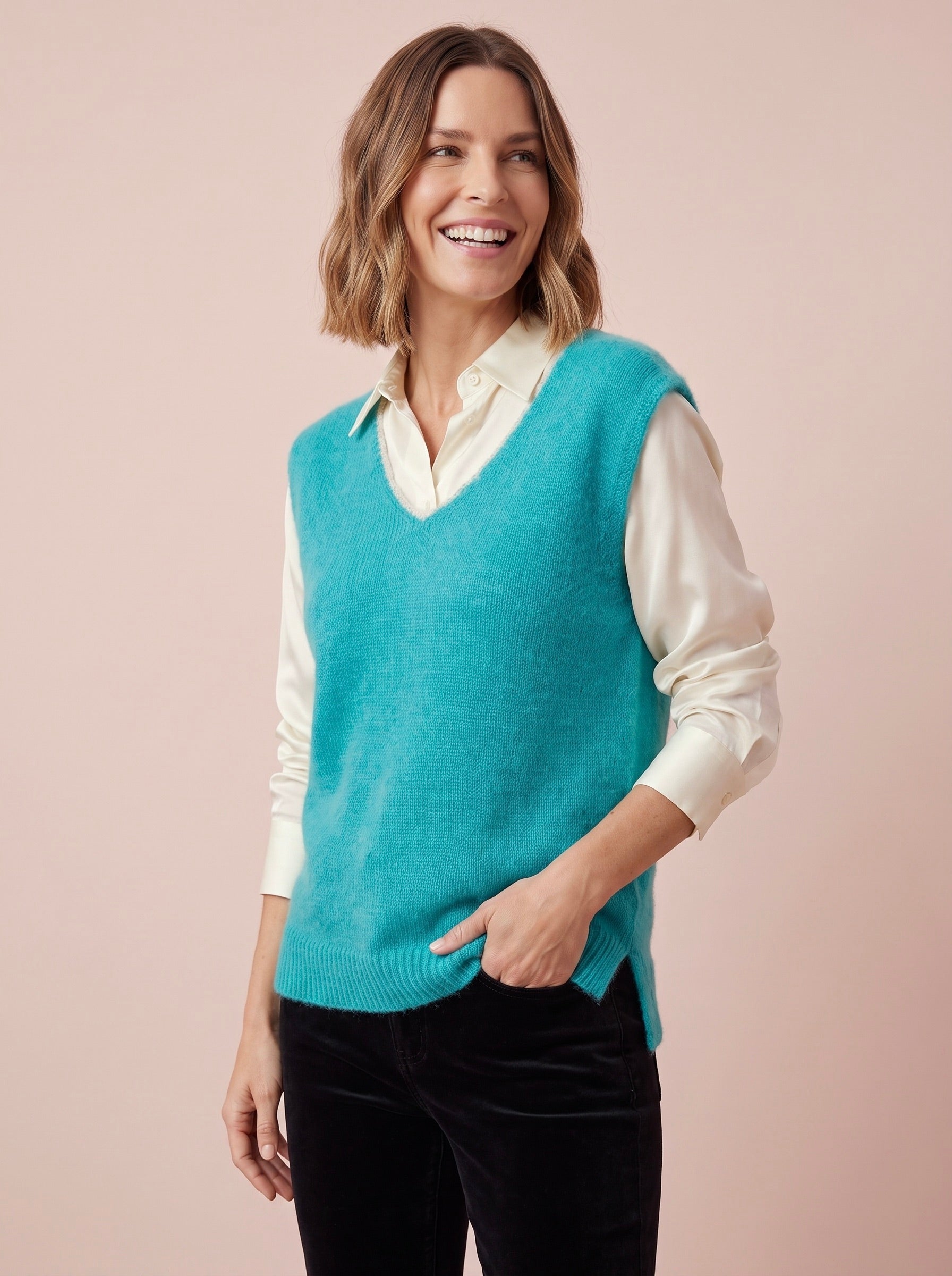 Women's teal V-neck knitted tank top with lurex trim and split hem detail