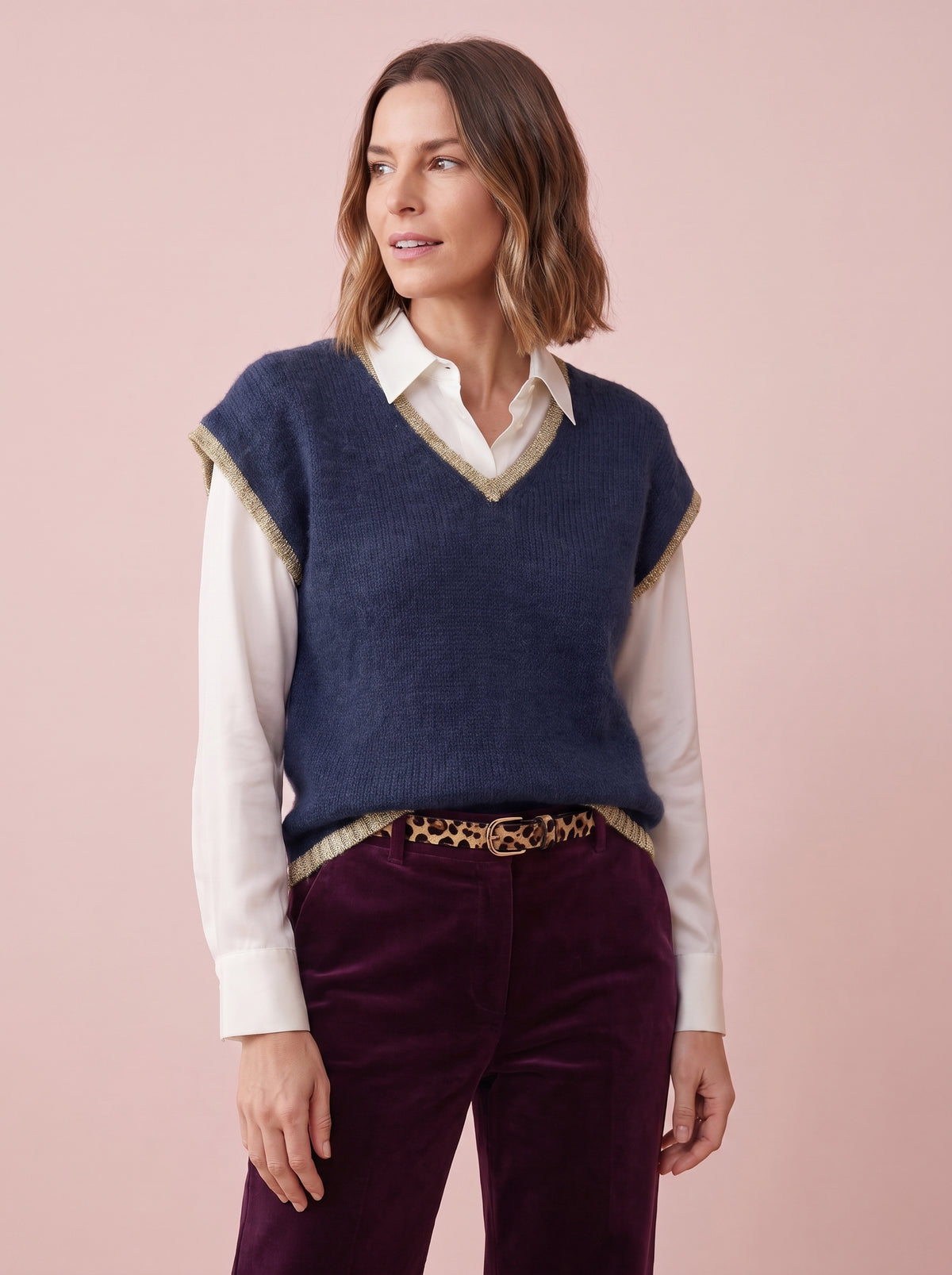 Navy knitted tank top with a relaxed fit and gold lurex trim along the V-neck armholes and hem